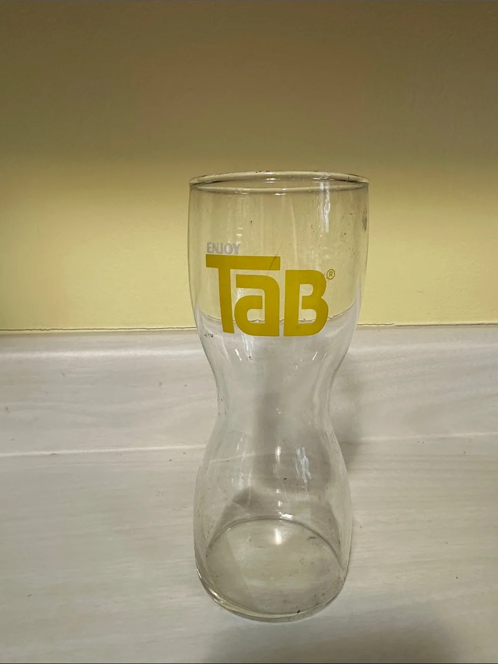 TAB Branded Clear Glass Carafe with Yellow Logo